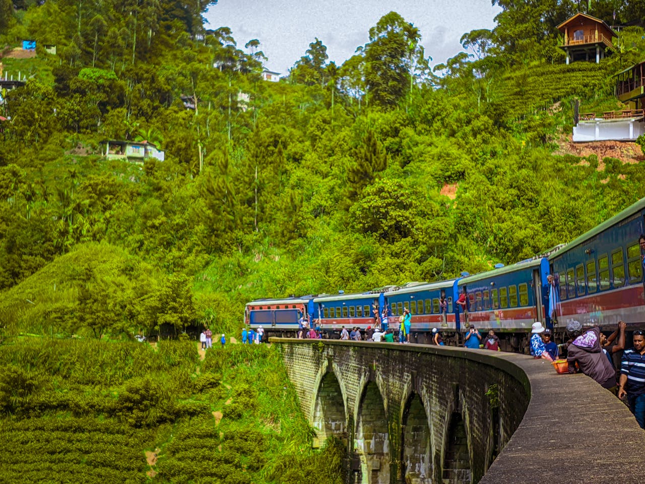 Explore the breathtaking views of the Nine Arch Bridge in Ella, Sri Lanka, with a scenic train ride.